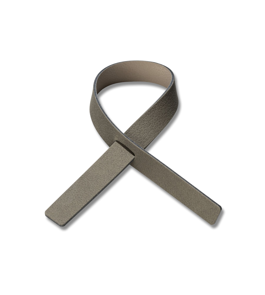 A NAPKIN LOOP (SET OF 4) made from recycled leather on a white background.