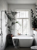 A HAPPY HOMES CREATIVE bathroom with plants and a tub from COZY.