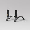 A minimalist design featuring a pair of ELDVARM COOPER FIRE DOGS with brass detail on a grey background.