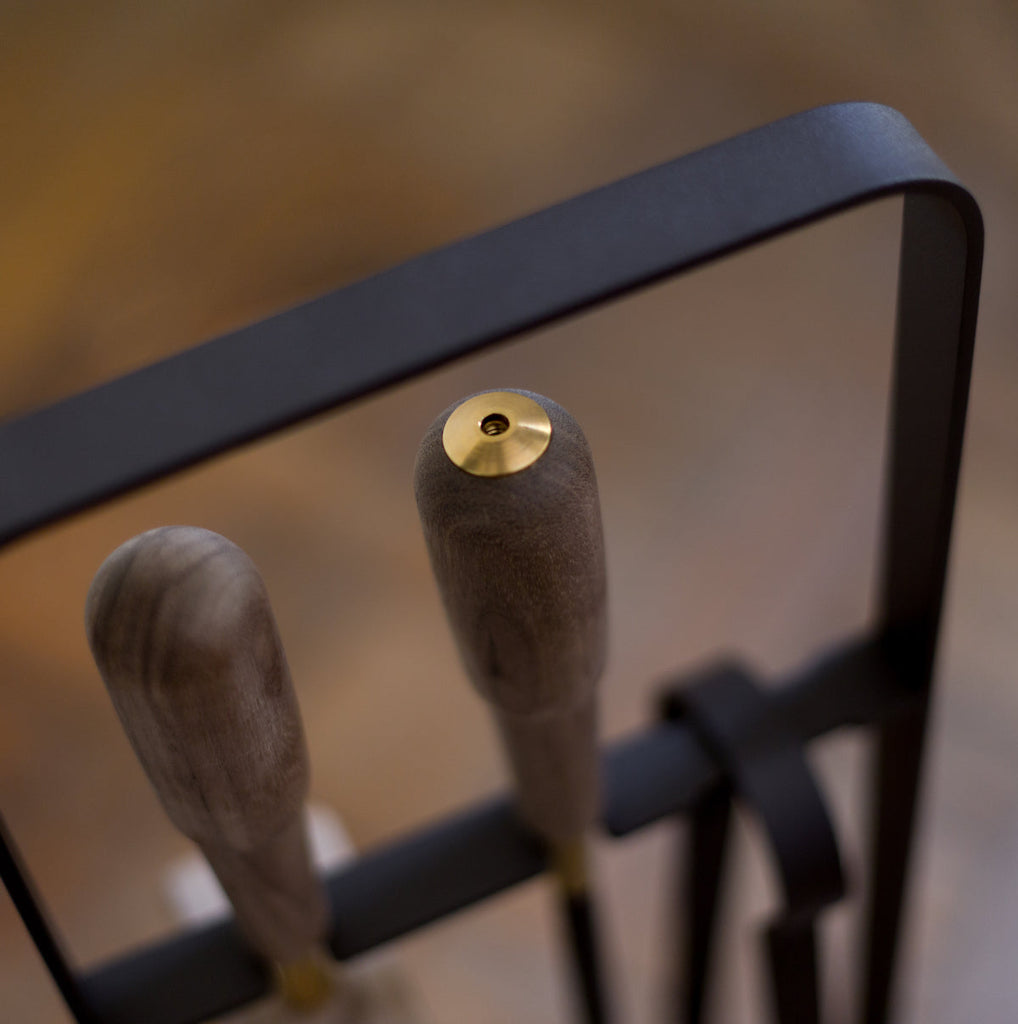 A pair of EMMA FIRE TOOL COMPANION SET utensils in an ELDVARM metal holder.