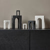 Four ARKIS MARBLE SCULPTURES by GEJST sit on top of a black dresser at Gestalt Haus.