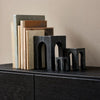 A set of Gestalt Haus MARBLE SCULPTURES on a black shelf by GEJST.