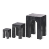 Three GEJST ARKIS MARBLE sculptures, black stools on a white background, exhibiting Gestalt Haus design principles.