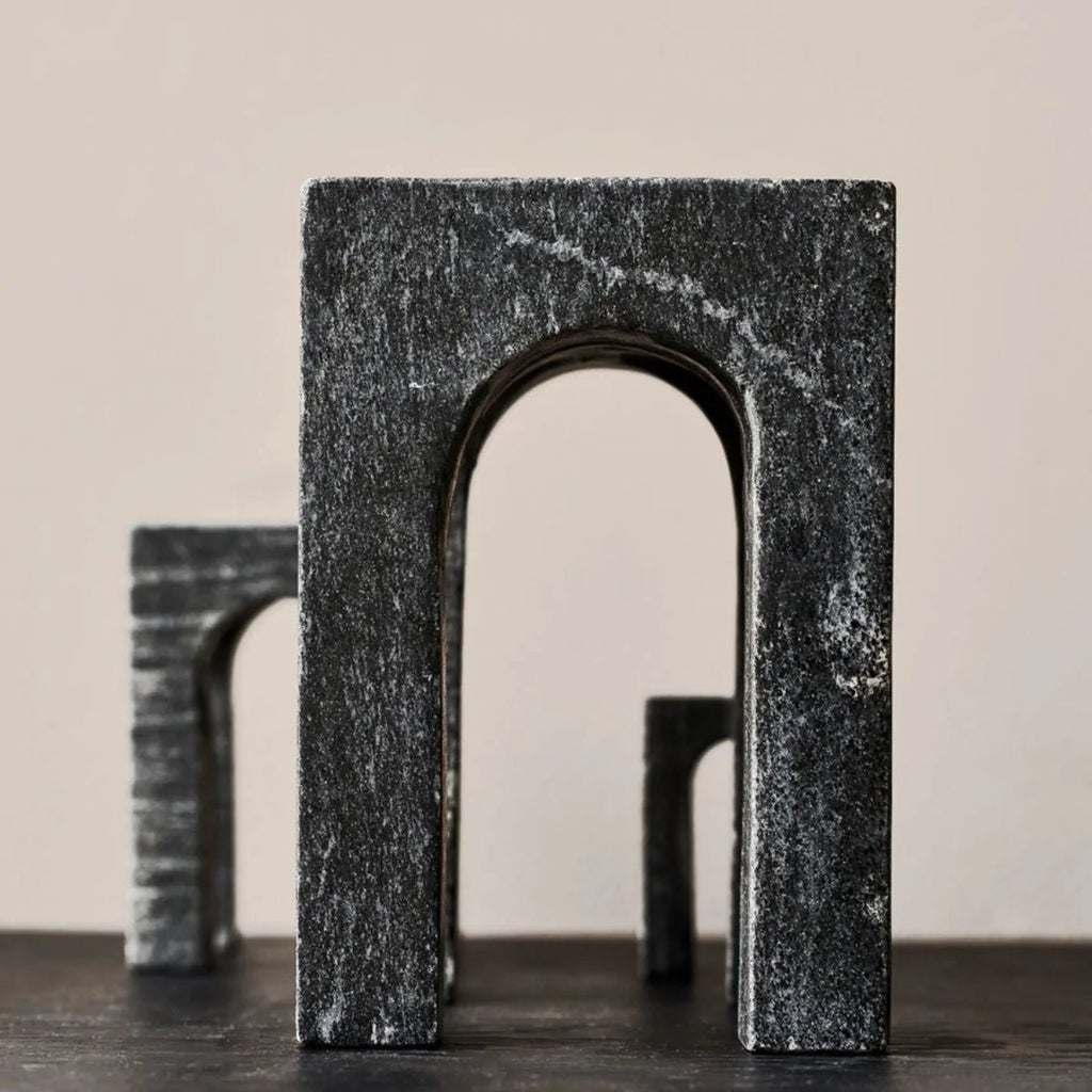 A pair of Gestalt Haus sculptures by GEJST on a table.