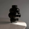 A LOUISE ROE BALLOON VASE 04 adorning a table at Gestalt Haus.