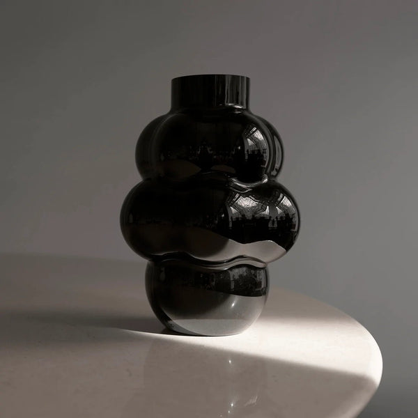 A LOUISE ROE BALLOON VASE 04 adorning a table at Gestalt Haus.