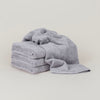 Four GESTALT HAUS BATH SHEETS stacked.