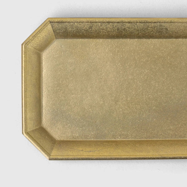 A brass stationery tray by Futagami in an octagonal shape from Gestalt Haus.