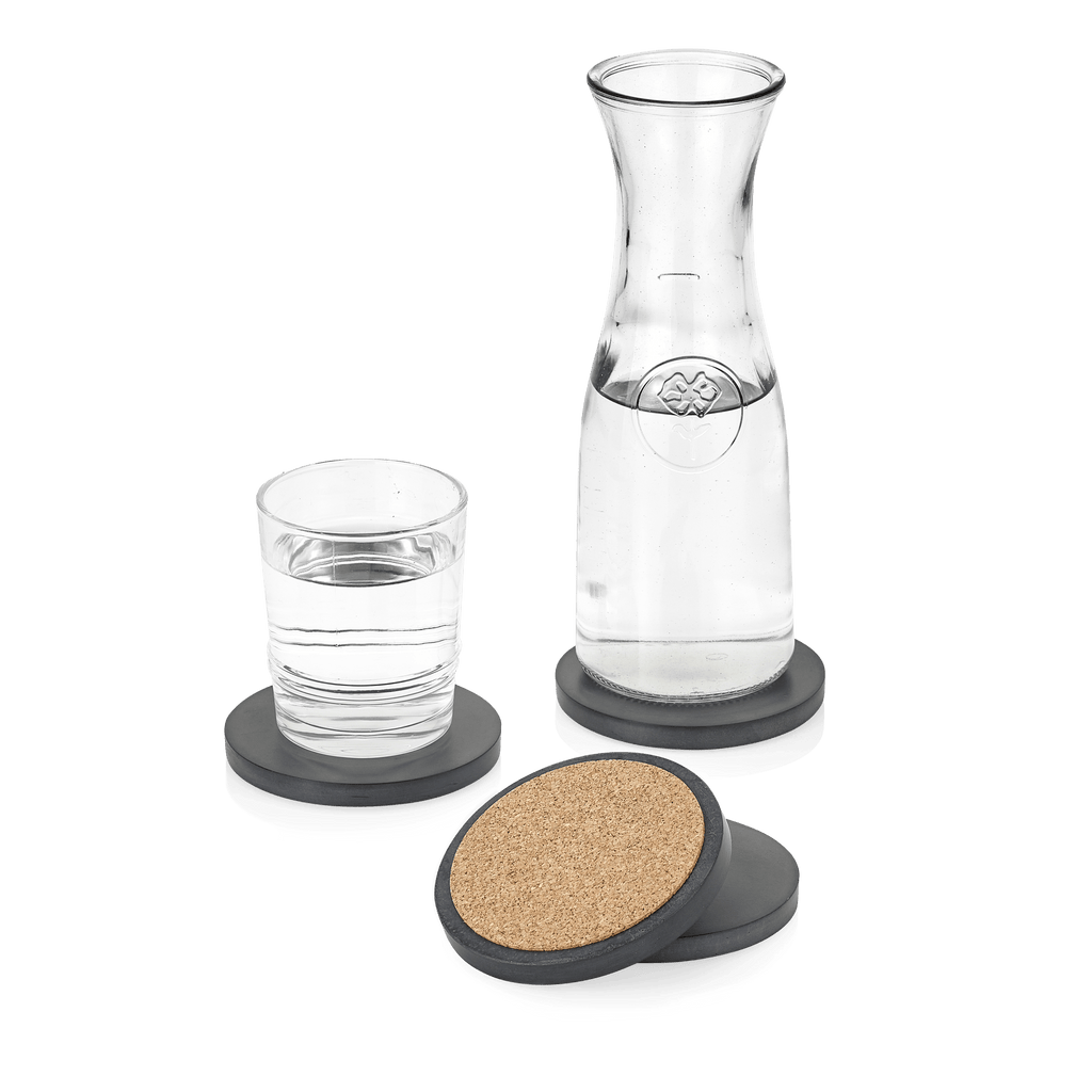 A water pitcher paired with a Gestalt Haus concrete coaster.