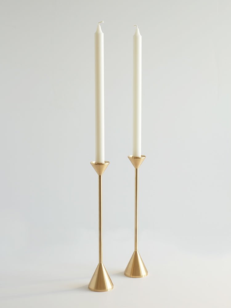 Two Gestalt Haus candle holders on a white background.