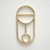A CREST BOTTLE OPENER with a circle in the middle.