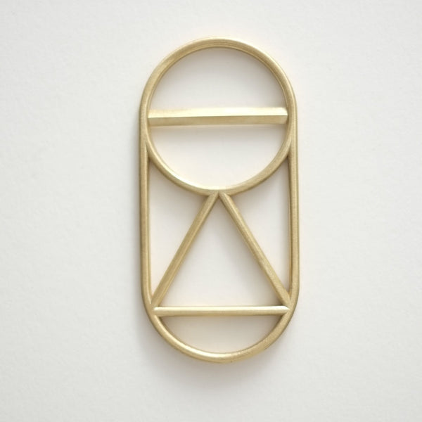 A CREST BOTTLE OPENER with the FS OBJECTS brand name on it.