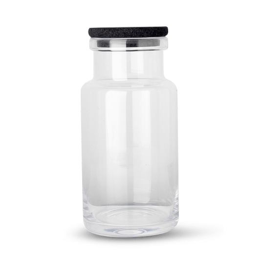 A Louise Roe glass container with a black lid, available at Gestalt Haus.