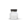 A clear glass container with a black lid by LOUISE ROE.