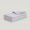 A stack of Gestalt Haus hand towels on a white background.