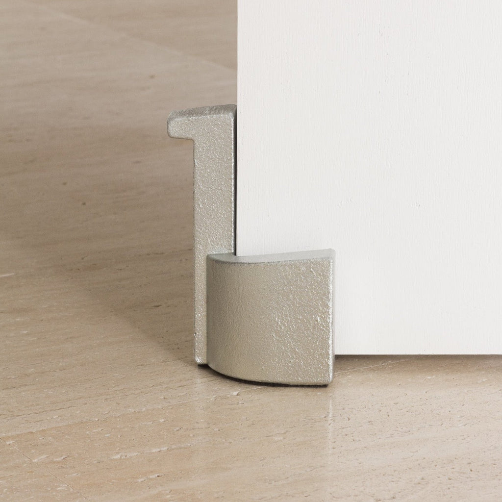 A Laker Studio white door with a metal handle on it.
