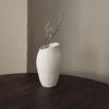 A MAGNOLIA VASE by SIBAST enhances the aesthetic of the wooden table in a Gestalt Haus.