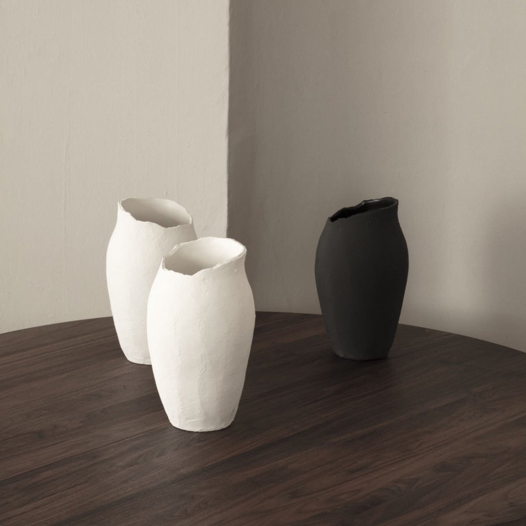 Three MAGNOLIA vases by SIBAST on a wooden table at Gestalt Haus.