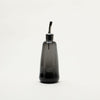 A Gary Bodker Designs Olive Oil Cruet in Gestalt Haus style on a white background.