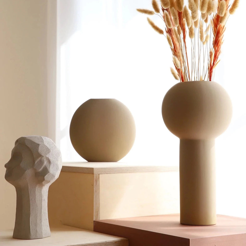 A Gestalt Haus COOEE OLLIE HEAD SCULPTURE displayed on a shelf.