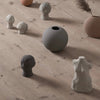 A group of OLUFEMI HEAD SCULPTURE vases on a wooden floor at Gestalt Haus, brand: COOEE.