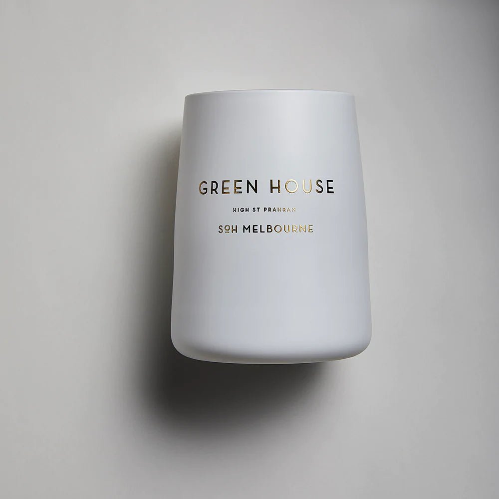 A SOH MELBOURNE GREENHOUSE CANDLE with the words green house on it.