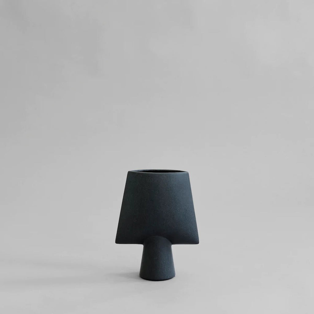 A SPHERE vase by 101 COPENHAGEN on a grey background.