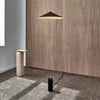 An ANONY wooden floor lamp and table in a Gestalt Haus room.