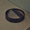 A VIDE POCHE ROND by STUDIO HENRY WILSON sitting on top of a concrete floor at Gestalt Haus.